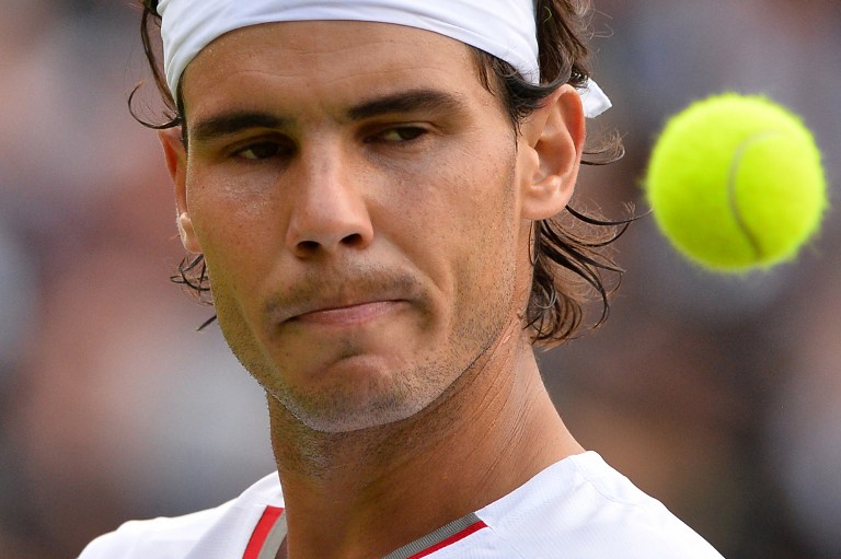 Spain's Rafael Nadal reacts after a point against Belgium's Steve Darcis during their men's first round match on day one of the 2013 Wimbledon Championships tennis tournament at the All England Club in Wimbledon, southwest London, on June 24, 2013. u00e2u20acu201c AF