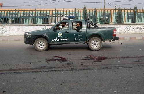 An Afghan police vehicle passes next to bloodstain from a site of an explosion in Jalalabad province, July 16, 2013. u00e2u20acu201d Reuters pic