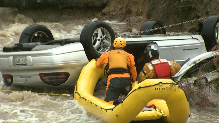 Emergency personnel work to rescue a man trapped in his vehicle during a flooding of Rock Creek in Lafayette, Colorado September 12, 2013, in this photo courtesy of CBS4 Denver. u00e2u20acu201d Reuters pic