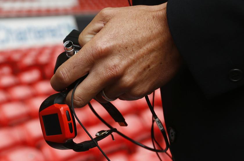Assistant Referee Lee Probert holds a watch linked to the Hawkeye system before the English Premier League soccer match between Liverpool and Stoke City at Anfield in Liverpool, northern England, August 17, 2013. u00e2u20acu201d Reuters pic