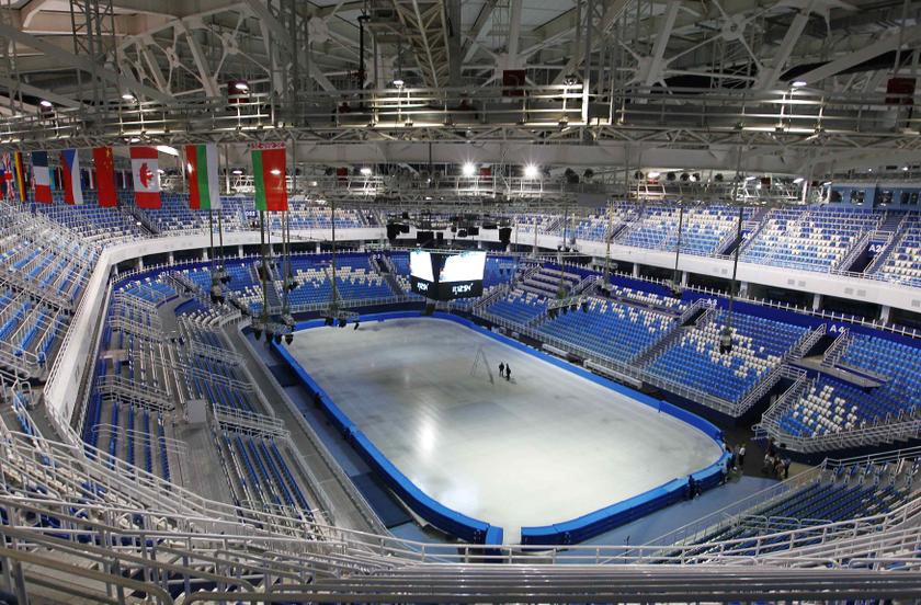 Two technicians stand on the ice as they work on the score clock at the Iceberg Skating Palace, as construction continues at the Olympic Park for the Sochi 2014 Winter Olympic Games in Adler August 20, 2013. u00e2u20acu201d Reuters pic