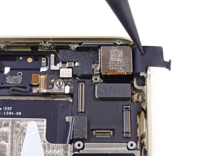 Handout image released by iFixit.com shows the removal of the rear facing camera from a new iPhone 5S handset during a product teardown in Melbourne, Australia September 20, 2013. — Reuters pic