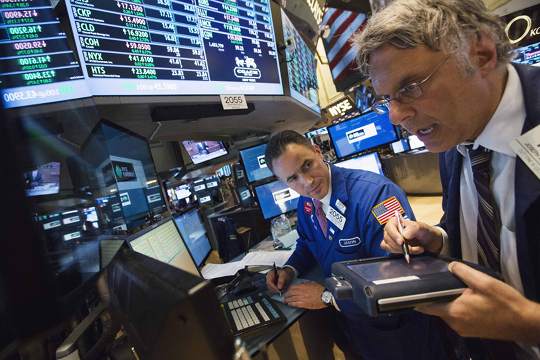 Traders work on the floor of the New York Stock Exchange shortly before the closing of the market in New York, July 11, 2013. u00e2u20acu201d Reuters pic