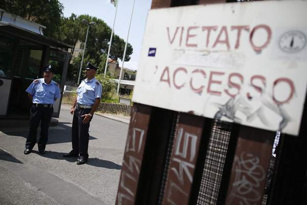 Security guards stand in front of the entrance of the courthouse in Rome June 28, 2013. u00e2u20acu201d Reuters pic