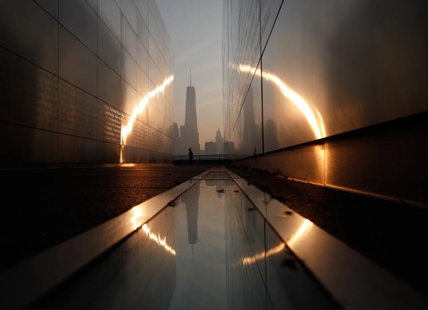 A man runs past the 9/11 Empty Sky memorial at sunrise across from New York's Lower Manhattan and One World Trade Center in Liberty State Park in Jersey City, New Jersey, September 11, 2013. u00e2u20acu201d Reuters pic