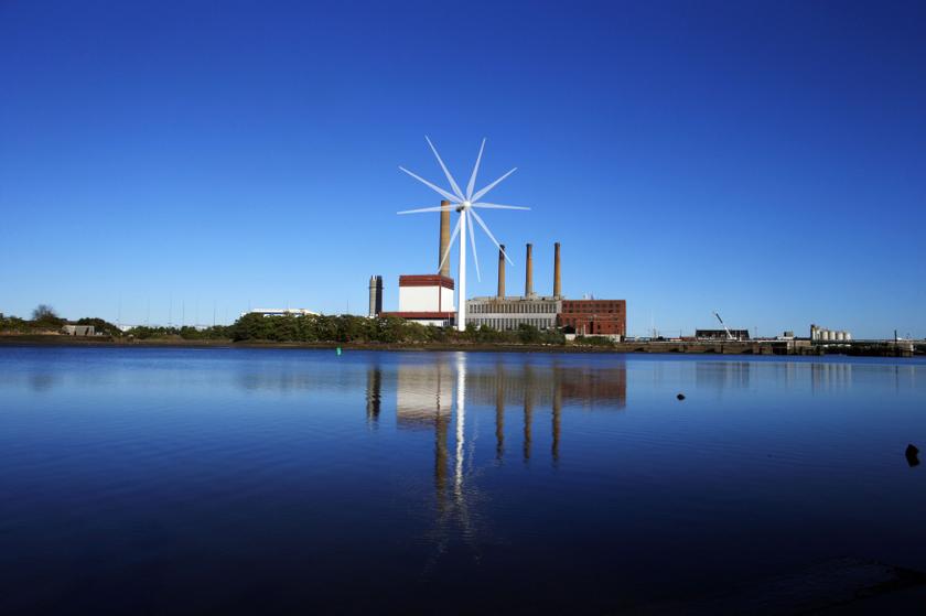 A Massachusetts Water Resources Authority wind turbine turns in front of a 1951 megawatt fossil fuel power plant in Charlestown, Massachusetts September 18, 2013. — Reuters pic