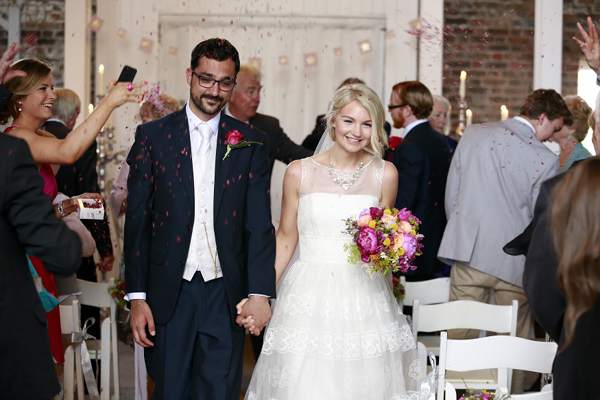 Newlyweds Brendan Hastings and Suzy Addis are covered in confetti after their humanist wedding ceremony at the Millhouse in the village of Slane, County Meath July 17, 2013. u00e2u20acu201c Reuters pic