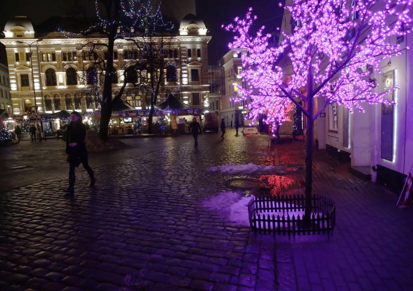 People walk past the Christmas market in Riga December 12, 2013. u00e2u20acu201d Reuters pic