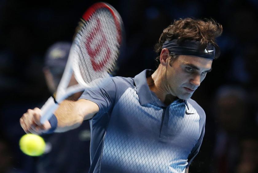 Roger Federer of Switzerland hits a return during his men's singles tennis match against Novak Djokovic of Serbia at the ATP World Tour Finals at the O2 Arena in London November 5, 2013. u00e2u20acu201d Reuters pic