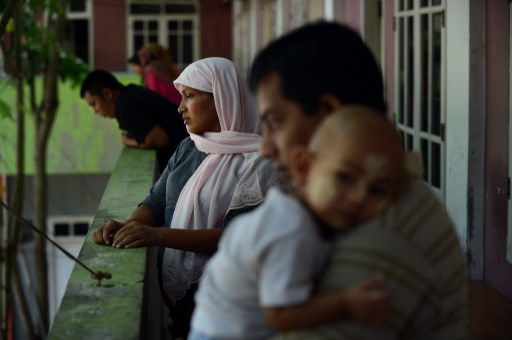 In this photograph taken on April 09, 2013, family of Rohingya asylum-seekers gather at the refugee housing complex in Medan city of North Sumatra province. u00e2u20acu201d AFP pic