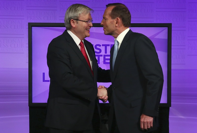 Australiau00e2u20acu2122s Prime Minister and leader of the Australian Labor Party Kevin Rudd shakes hands with the leader of the conservative opposition Tony Abbott before the start of their debate in Canberra August 11, 2013. u00e2u20acu201d Reuters pic