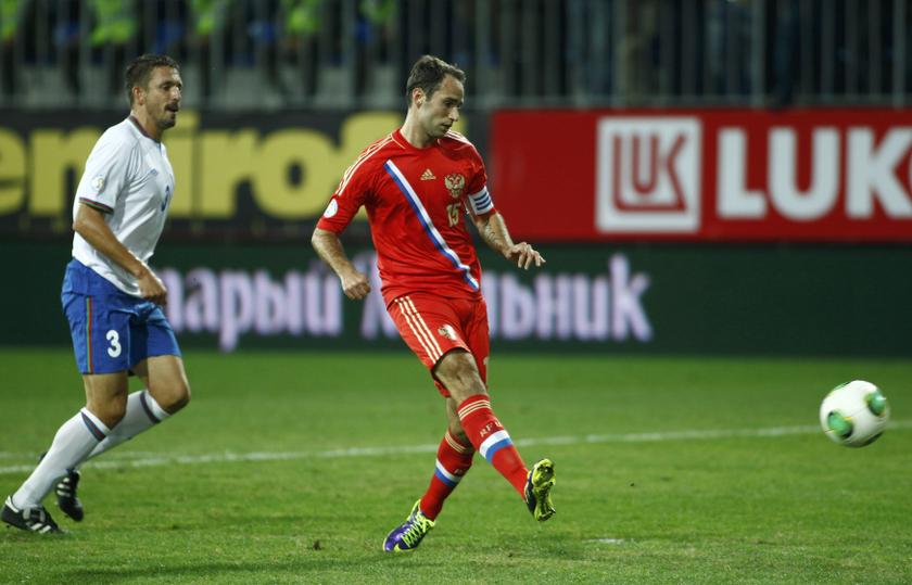Russia's Roman Shirokov (right) shoots to score during the 2014 World Cup qualifying match against Azerbaijan in Baku, October 15, 2013. u00e2u20acu201d Reuters pic