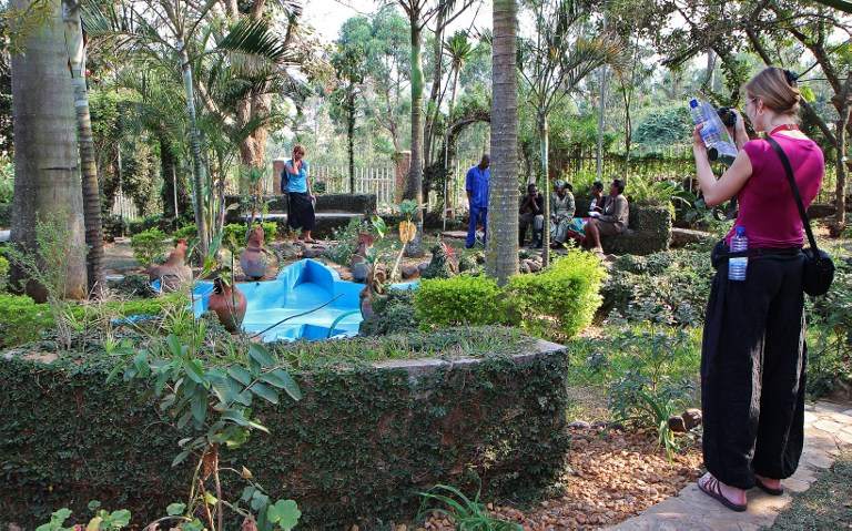 A tourist takes a picture at the Rwanda Genocide memorial in Kigali on July 23, 2013. u00e2u20acu201d AFP pic