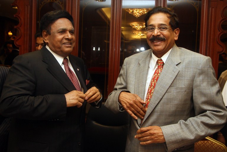 Outgoing MIC president Datuk Seri S. Samy Vellu (left) stands with the new leader Datuk G. Palanivel at the party headquarters in Kuala Lumpur on December 6, 2010. u00e2u20acu201d AFP pic