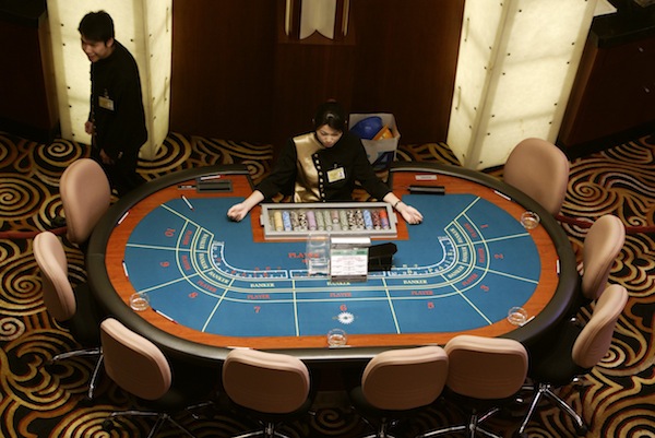 A high angle view of croupiers prepare to greet visitors at Sands Macau casino in Macau, a former Portuguese enclave before reverting to Chinese rule, in this May 18, 2004 file photo. u00e2u20acu201d Reuters pic
