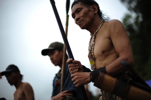 This picture taken on August 21, 2009, shows Penan tribes people manning a blockade against timber and plantation company vehicles in Long Belok in Sarawak.