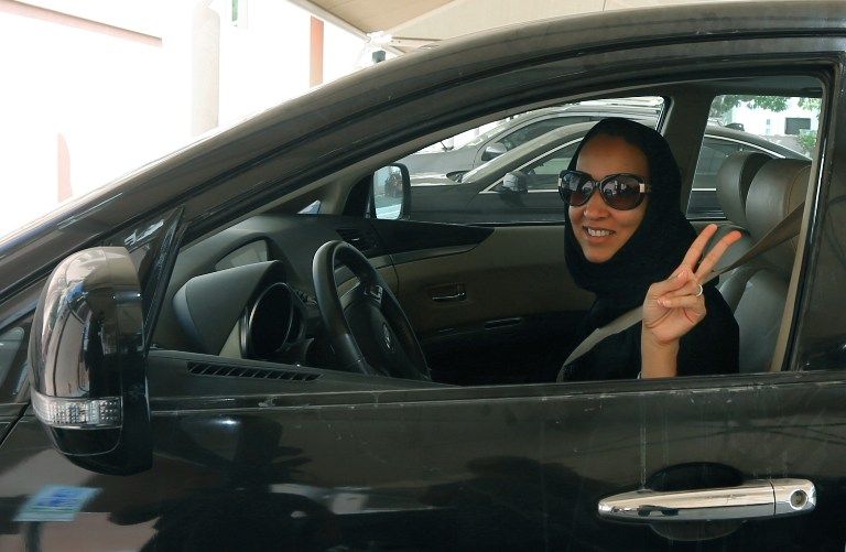 Saudi activist Manal Al Sharif, who now lives in Dubai, drives her car in the Gulf Emirate city on October 22, 2013, in solidarity with Saudi women campaigning on Oct 26 for women's right to drive AFP pic