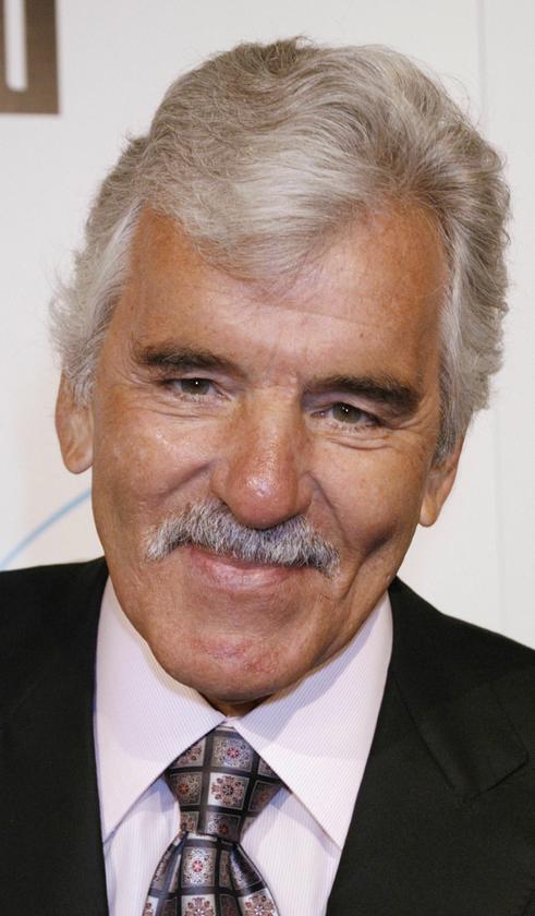 Actor Dennis Farina poses at the premiere of his new film ,The Grand,, in Hollywood, California in this file photo taken March 5, 2008. Farina, a former Chicago policeman turned tough-guy actor, died in Scottsdale, Arizona, on Monday