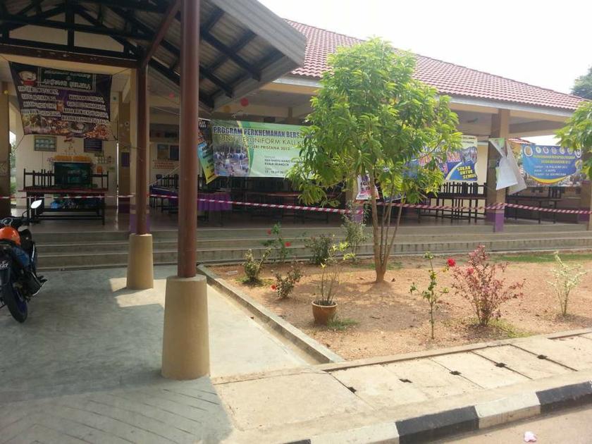 A cordon is seen around the sealed-off school canteen.