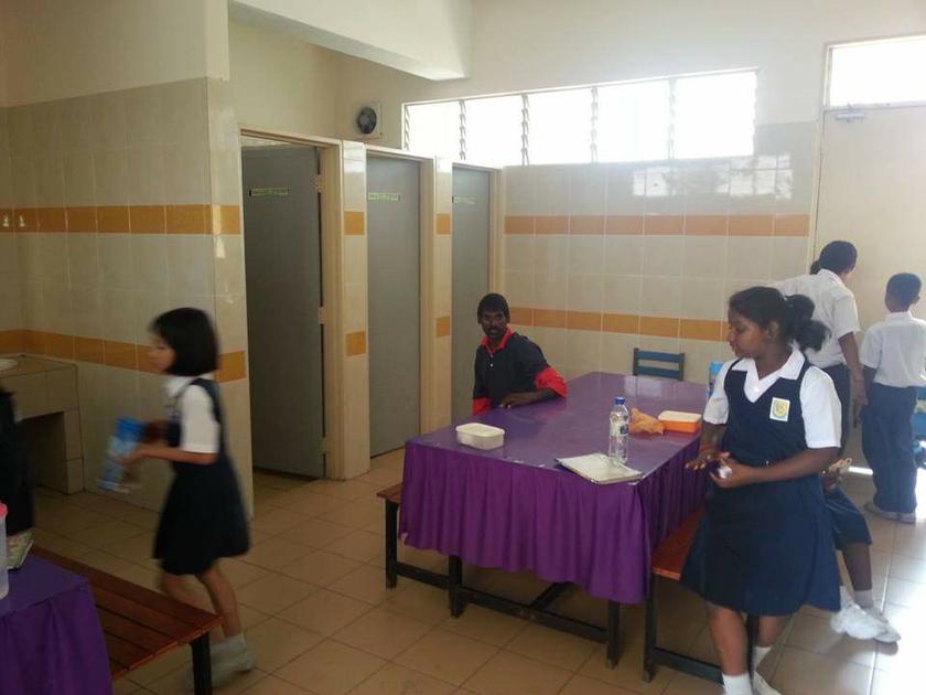 A picture taken off the Facebook posting showing the students having their meal in the school toilet.