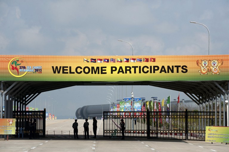 This photo taken on December 1, 2013 shows Myanmar policemen standing guard at a sport centre ahead of the Southeast Asian Games (SEA Games) in Naypyidaw. u00e2u20acu201d AFP pic