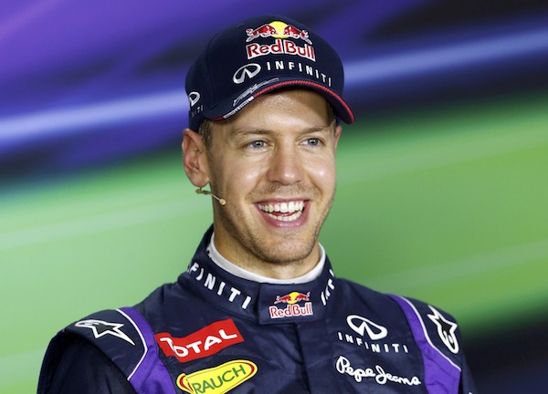 Red Bull Formula One driver Sebastian Vettel of Germany smiles during a news conference after the qualifying session of the Singapore F1 Grand Prix at the Marina Bay street circuit in Singapore September 21, 2013. u00e2u20acu201d Reuters pic