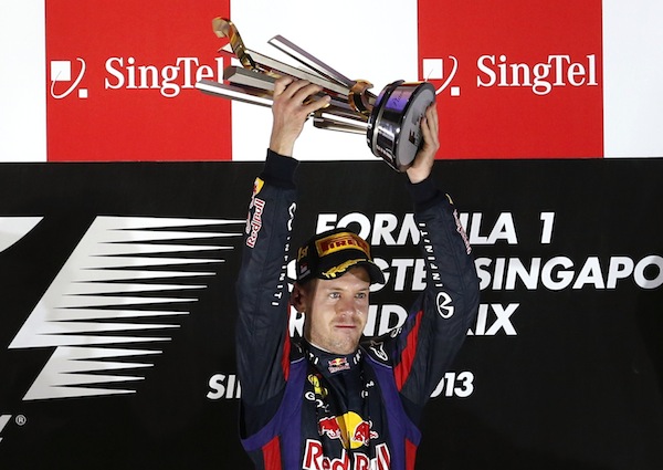 Red Bull Formula One driver Sebastian Vettel of Germany celebrates with the trophy after winning the Singapore F1 Grand Prix in Singapore September 22, 2013. u00e2u20acu201d Reuters pic