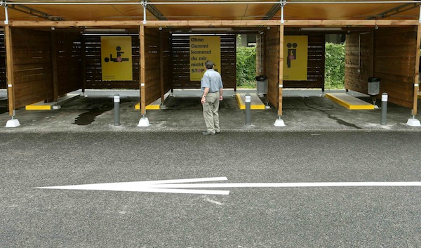 A man stands in front of a so-called u00e2u20acu02dcsex boxu00e2u20acu2122 during a tour on an open day at a sex drive-in, west of Zurich August 24, 2013. u00e2u20acu201d Reuters pic