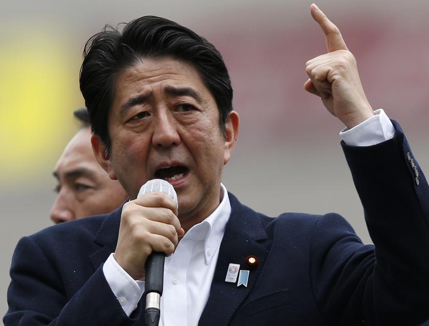 Japan's Prime Minister Shinzo Abe, who is also leader of the ruling Liberal Democratic Party, speaks to voters atop a campaign van in Tokyo July 4, 2013, at the start day of campaign the July 21 Upper house election. u00e2u20acu201d Reuters pic