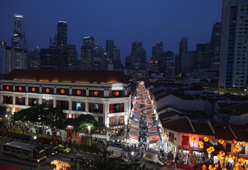 People shop for new year goodies ahead of the Lunar New Year in Chinatown in the central business district of Singapore January 24, 2014.  u00e2u20acu201d Reuters pic