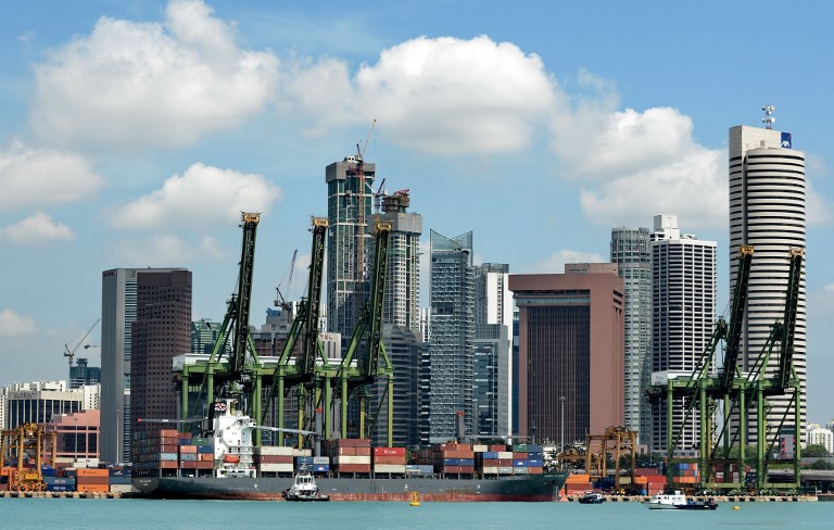 File photo shows the Keppel container port next to the financial district in Singapore on April 12, 2013. u00e2u20acu201d AFP pic