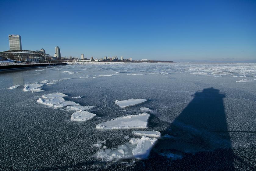 The shadow of a light house is seen in the frozen waters of the port of Milwaukee as another round of arctic air blasts the midwest, keeping the wind chill in the negative numbers, in Milwaukee, Wisconsin February, 6, 2014.u00c2u00a0u00e2u20acu201d Reuters pic