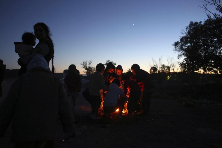Children gather around a bonfire to get warm in the shanty town settlement of El Gallinero, on the outskirts of Madrid November 23, 2013. u00e2u20acu201d Reuters pic