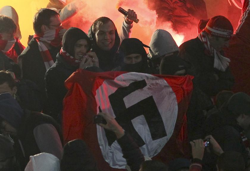 People demonstrate as they hold a Nazi flag displaying a swastika at the stands of the Spartak Moscow supporters during the Russian Cup 1/16 match finals between Shinnik Yaroslavl and Spartak Moscow in Yaroslavl, October 30, 2013. u00e2u20acu201d Reuters pic