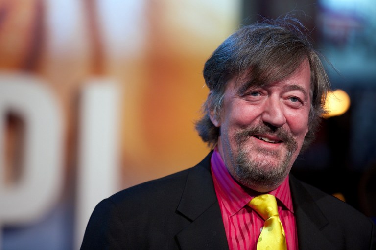 British actor Stephen Fry poses for pictures on the red carpet as he arrives for the UK premier of ,Life of Pi, at the Empire cinema, central London, on Dec 3, 2012. u00e2u20acu201d AFP pic