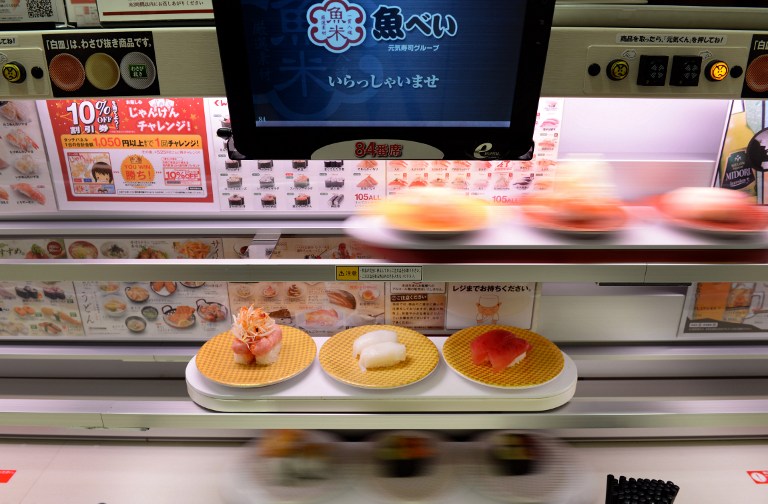 In a photo taken on June 10, 2013, three decks of u00e2u20acu02dchigh-speedu00e2u20acu2122 lanes transport sushi dishes for customers at the Uobei sushi restaurant in Tokyo. u00e2u20acu201d AFP  
