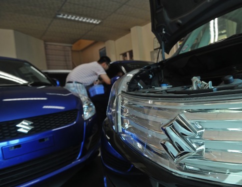 Suzuki cars are displayed at a show room in Yangon on February 6, 2013. u00e2u20acu201d AFP pic