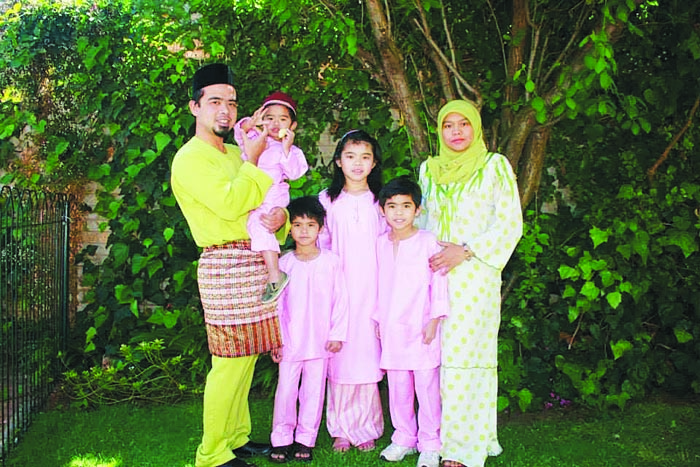 The couple, who allegedly smacked their son for not performing his prayers, and their children.