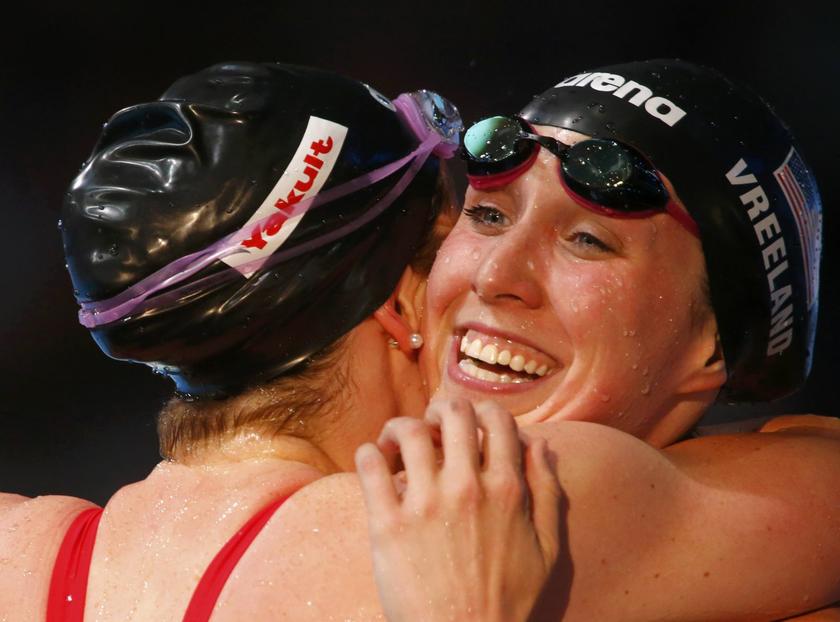 Winner Missy Franklin of the U.S. hugs compatriot Shannon Vreeland (R) after the women's 200m freestyle final during the World Swimming Championships at the Sant Jordi arena in Barcelona July 31, 2013