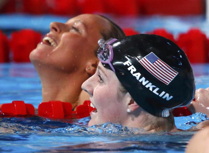 Winner Missy Franklin of the U.S. (R) and second placed Federica Pellegrini of Italy (L) react after the women's 200m freestyle final during the World Swimming Championships at the Sant Jordi arena in Barcelona July 31, 2013