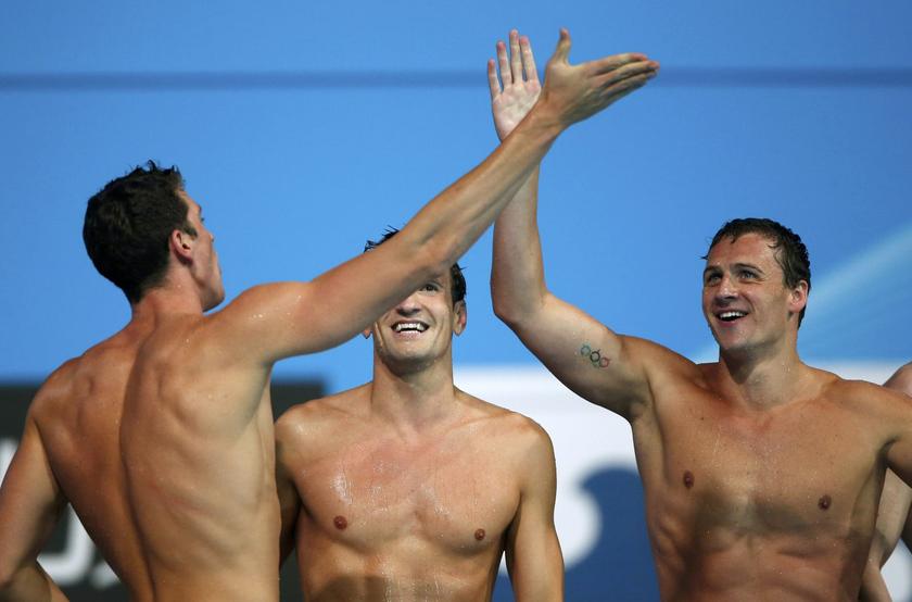 Members of Team U.S. celebrate after winning the men's 4x200m freestyle final during the World Swimming Championships at the Sant Jordi arena in Barcelona August 2, 2013. From left: Conor Dwyer, Charles Gipson Houchin and Ryan Lochte