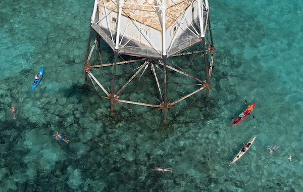 Swimmers in the inaugural Alligator Reef Lighthouse Swim round the half-way point at Alligator Lighthouse off Islamorada, Florida in this September 21, 2013 handout photo. u00e2u20acu201d Reuters pic