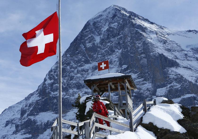 Chinese ski instructor Xu Zhongxing poses on the Kleine Scheidegg in front of the Eiger north face in the ski resort of the Jungfrau region January 8, 2014. u00e2u20acu201d Reuters pic