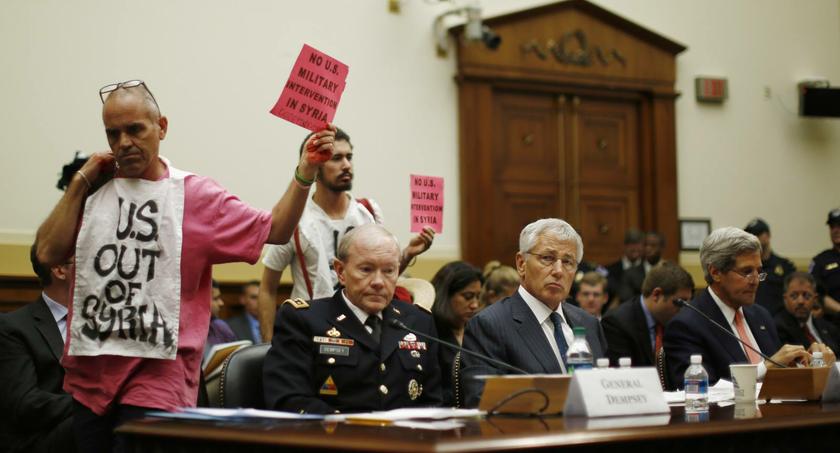 Protesters interrupt proceedings at the House Foreign Affairs Committee hearing.