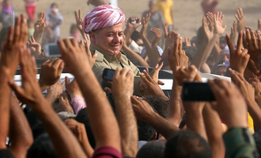 Iraqi Kurdish President Massoud Barzani (C) visits Syrian refugees at the Quru Gusik refugee camp in Arbil, about 350 km (220 miles) north of Baghdad, August 19, 2013