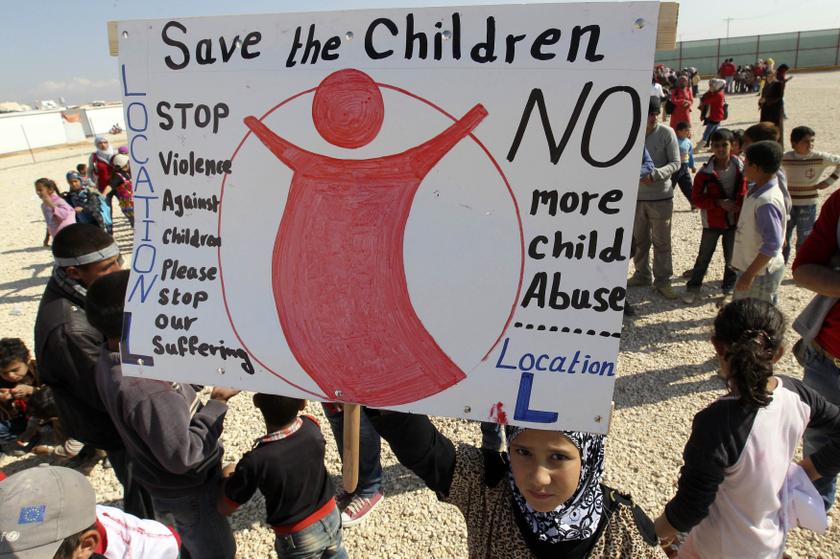 Syrian refugee children shout 'No to violence' during a UNICEF and Save the Children organised event to mark 'Universal Children's Day' at Al Zaatari refugee camp in the Jordanian city of Mafraq, near the border with Syria November 20, 2013. u00e2u20acu201d Reuters p
