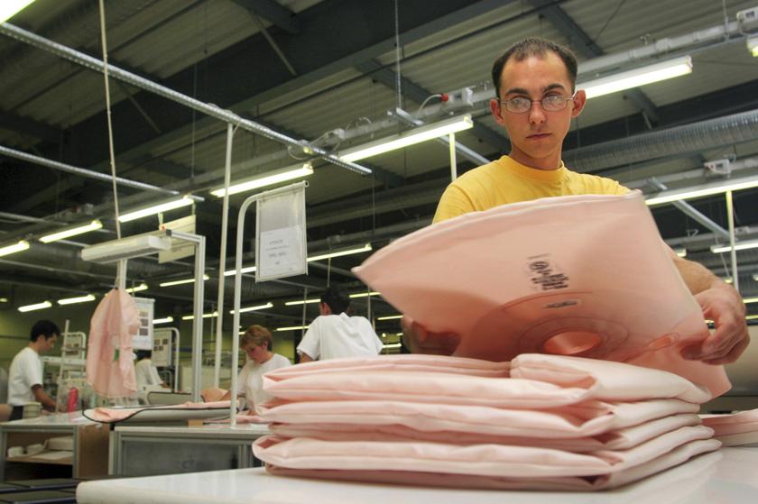 A man arranges airbag cushions manufactured by Japanese car parts maker Takata Corp. at a factory in this September 4, 2006 file photo. u00e2u20acu2022 Reuters pic  