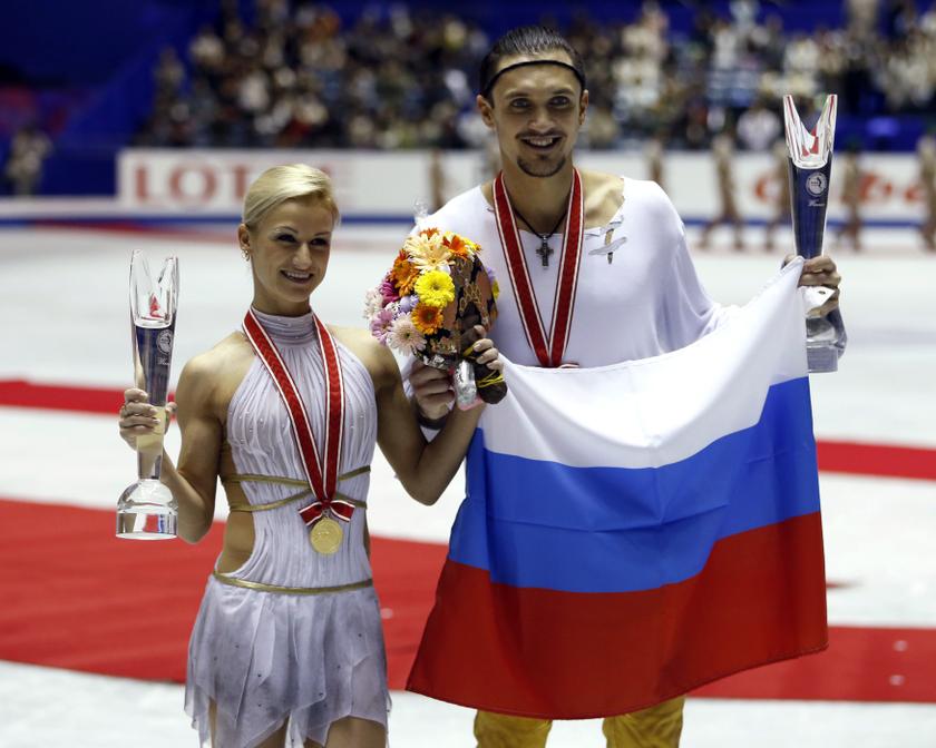 Tatiana Volosozhar and Maxim Trankov of Russia pose with the gold medals and their trophies during the award ceremony of the pairs free skating programme at the ISU Grand Prix of Figure Skating in Tokyo November 9, 2013.