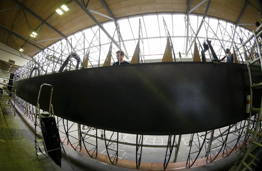 The 72 metre long wing of the solar-powered Solar Impulse HB-SIB airplane during assembly at the airport in Duebendorf near Zurich October 11, 2013