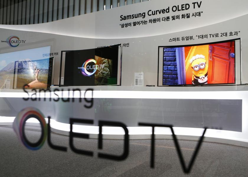 Samsung Electronics' first curved, super-thin OLED television sets are displayed at the main office of the company in Seoul June 27, 2013. Samsung slapped a $13,000 price tag on its first curved, super-thin OLED television to go on sale, the same price as